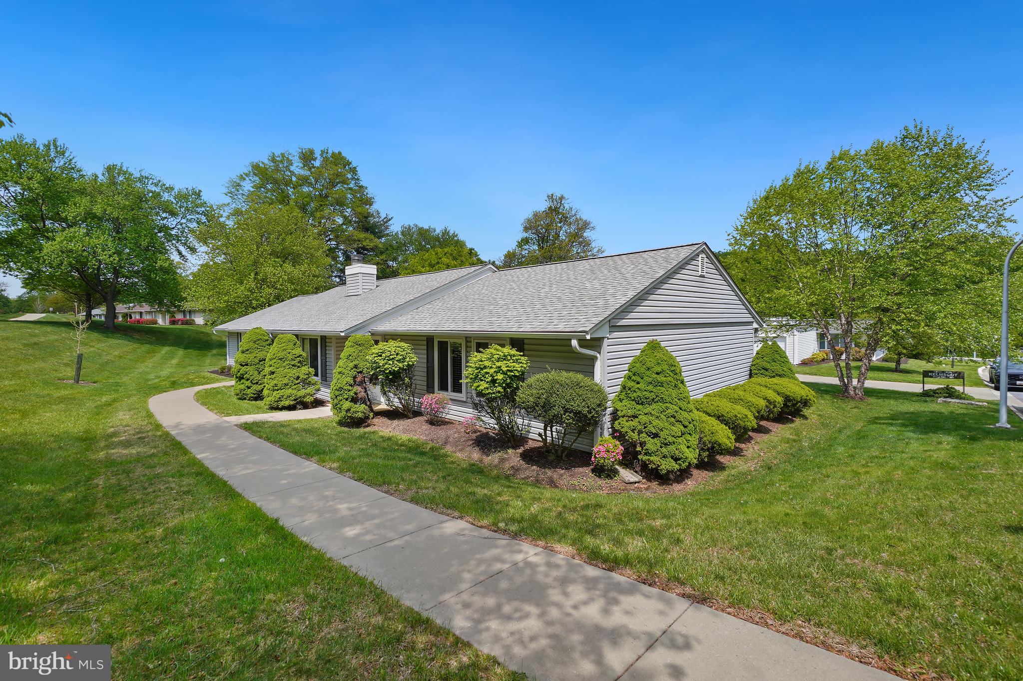 a view of an house with backyard space and garden