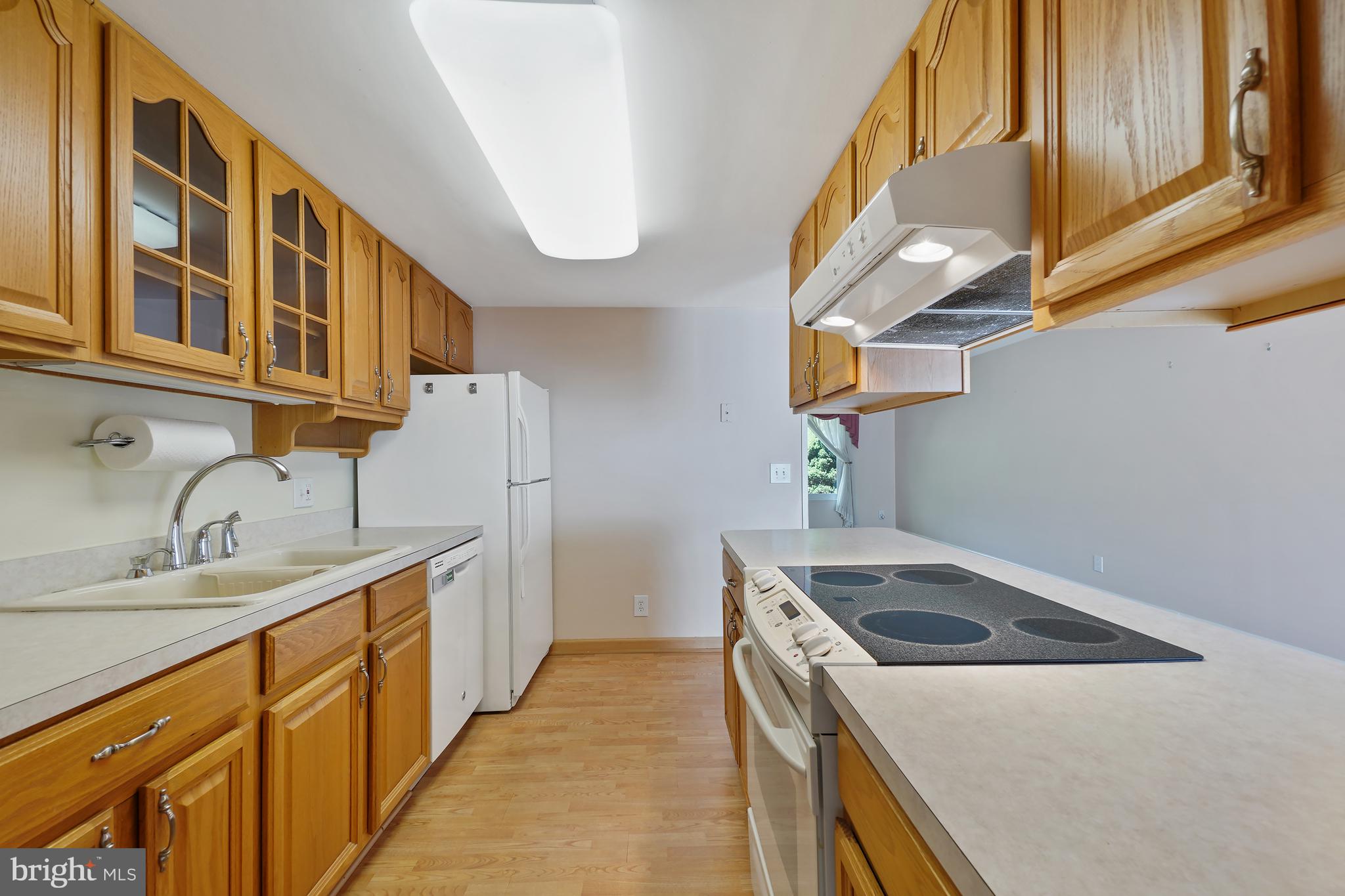 14550 Kelmscot Drive, Unit 186A Silver Spring, MD 20906 - Photo 14 of 29 a utility room with cabinets and washer