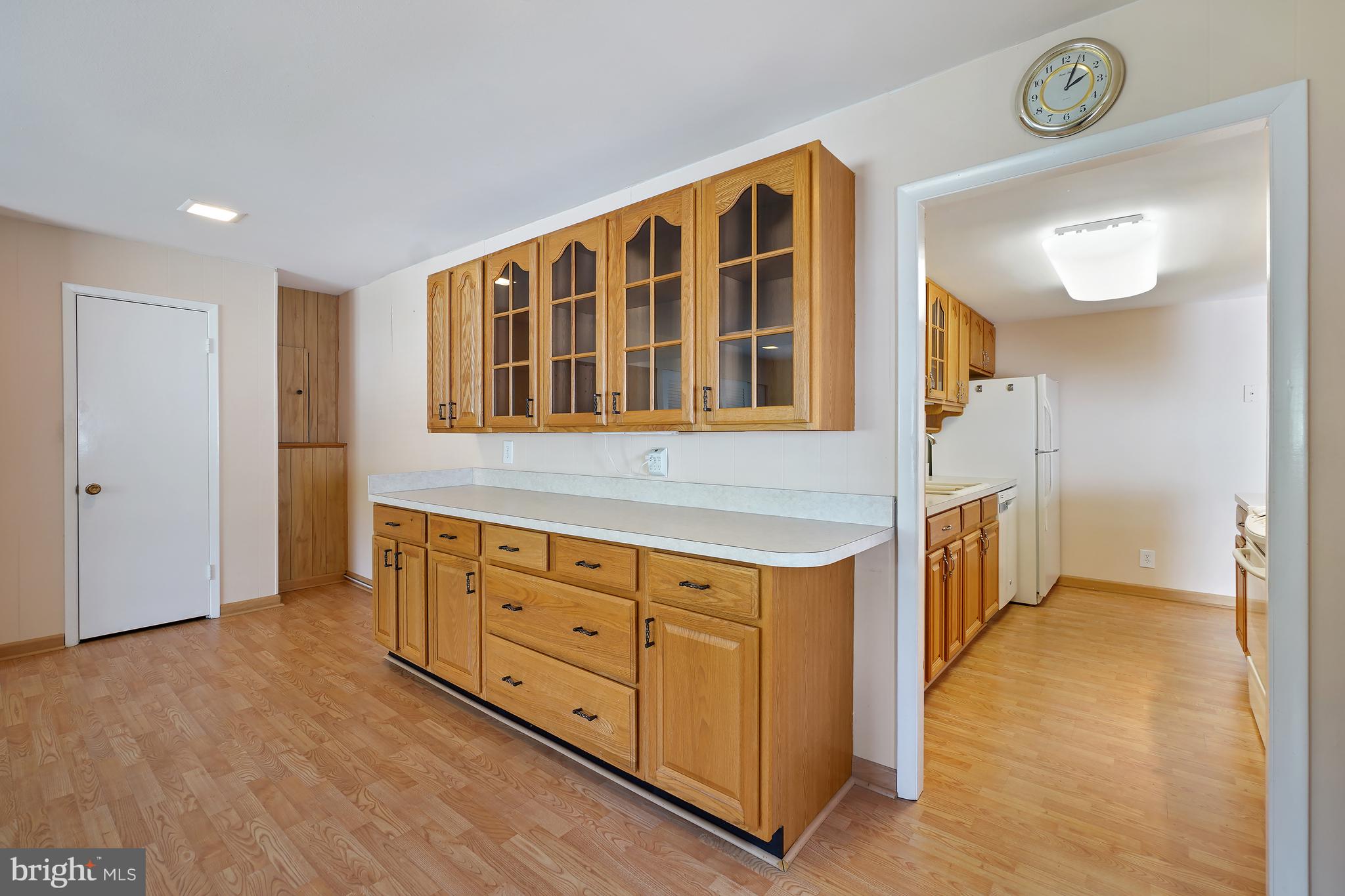 14550 Kelmscot Drive, Unit 186A Silver Spring, MD 20906 - Photo 18 of 29 a kitchen with cabinets and wooden floor