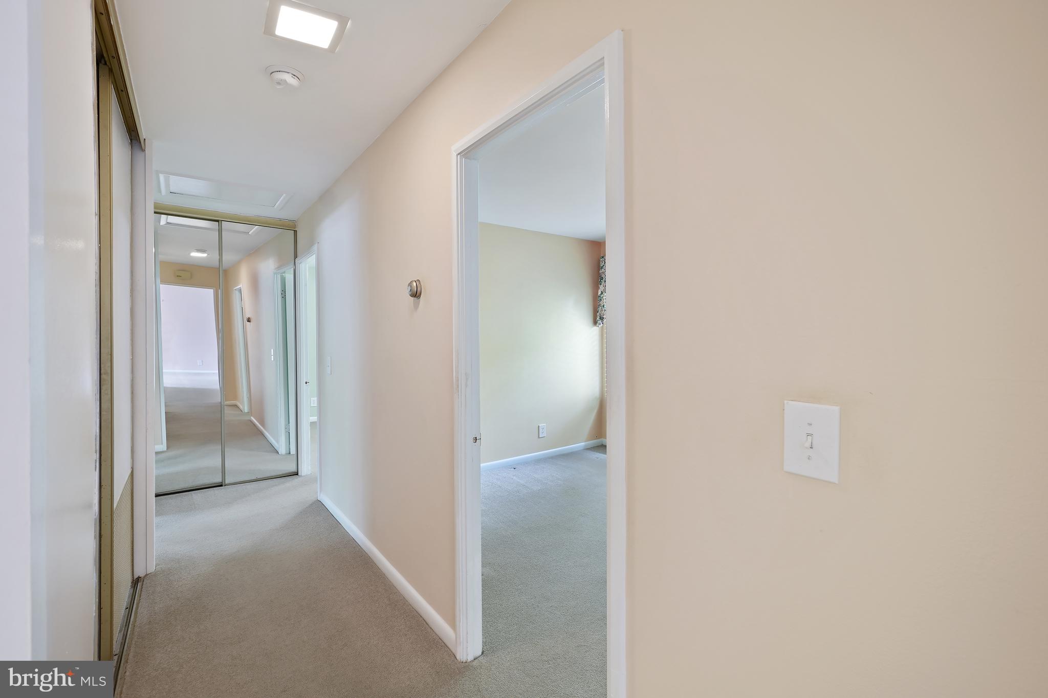 14550 Kelmscot Drive, Unit 186A Silver Spring, MD 20906 - Photo 19 of 29 a view of a hallway with closet and a bathroom