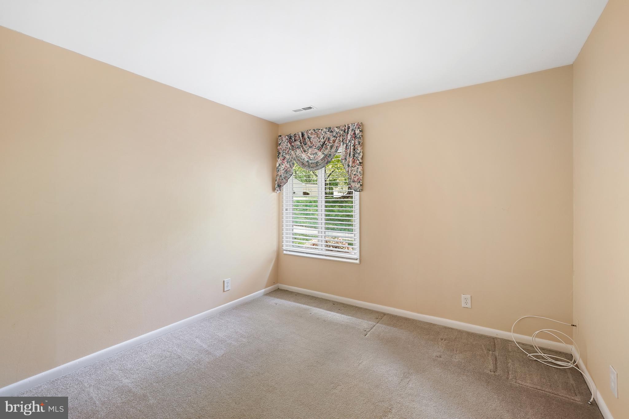 14550 Kelmscot Drive, Unit 186A Silver Spring, MD 20906 - Photo 21 of 29 a view of an empty room with a window