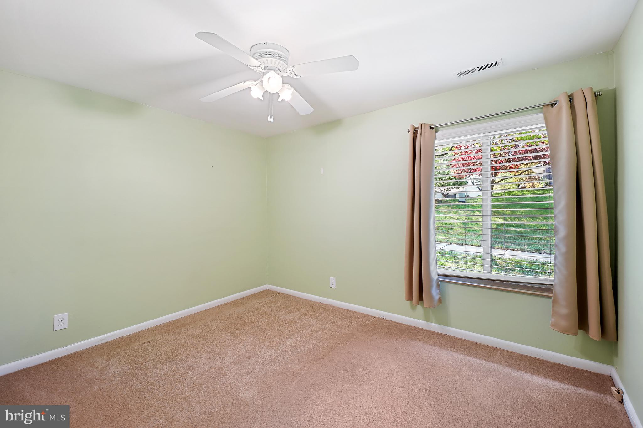 14550 Kelmscot Drive, Unit 186A Silver Spring, MD 20906 - Photo 22 of 29 a view of an empty room with a window
