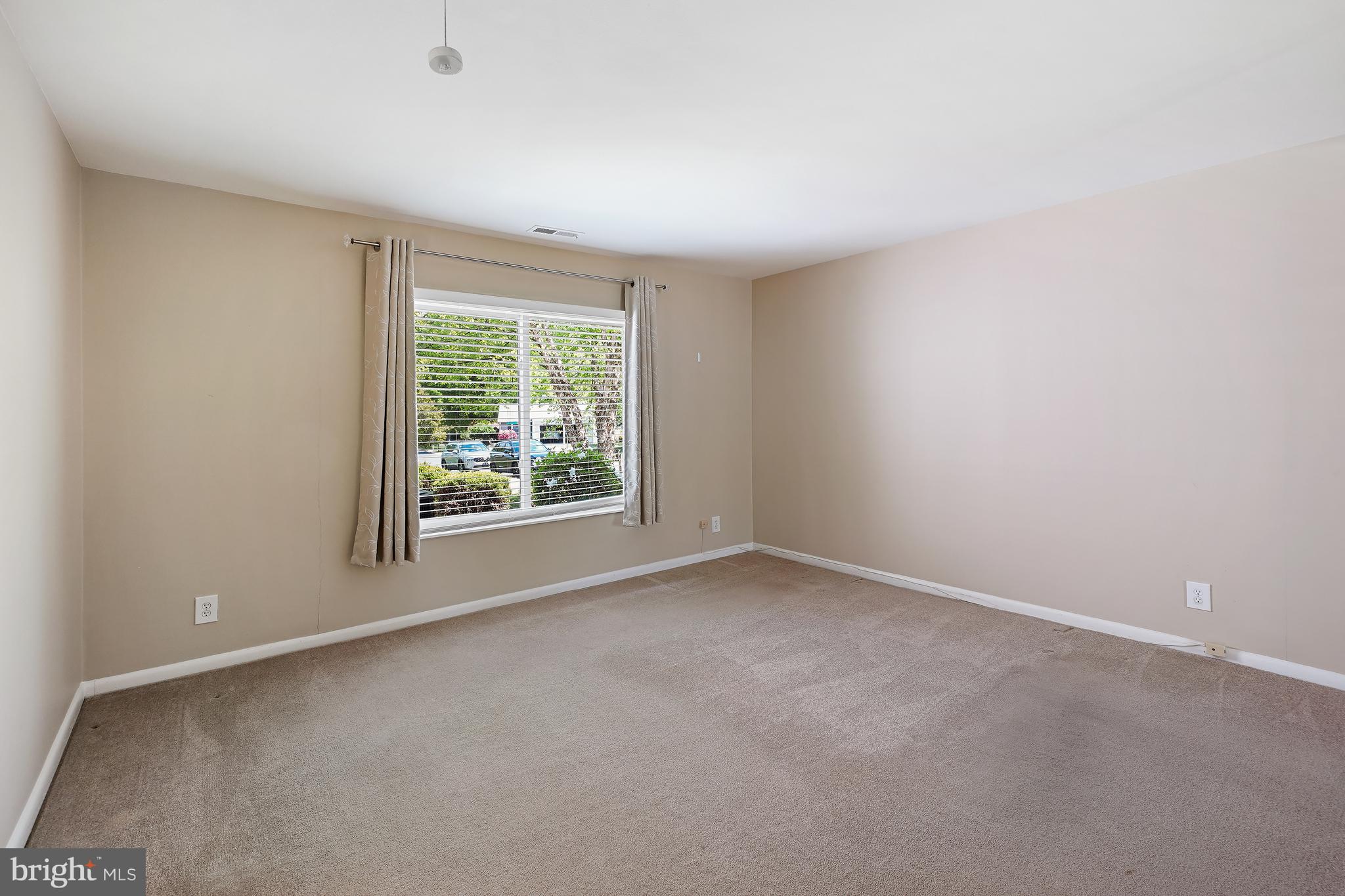 14550 Kelmscot Drive, Unit 186A Silver Spring, MD 20906 - Photo 23 of 29 an empty room with windows