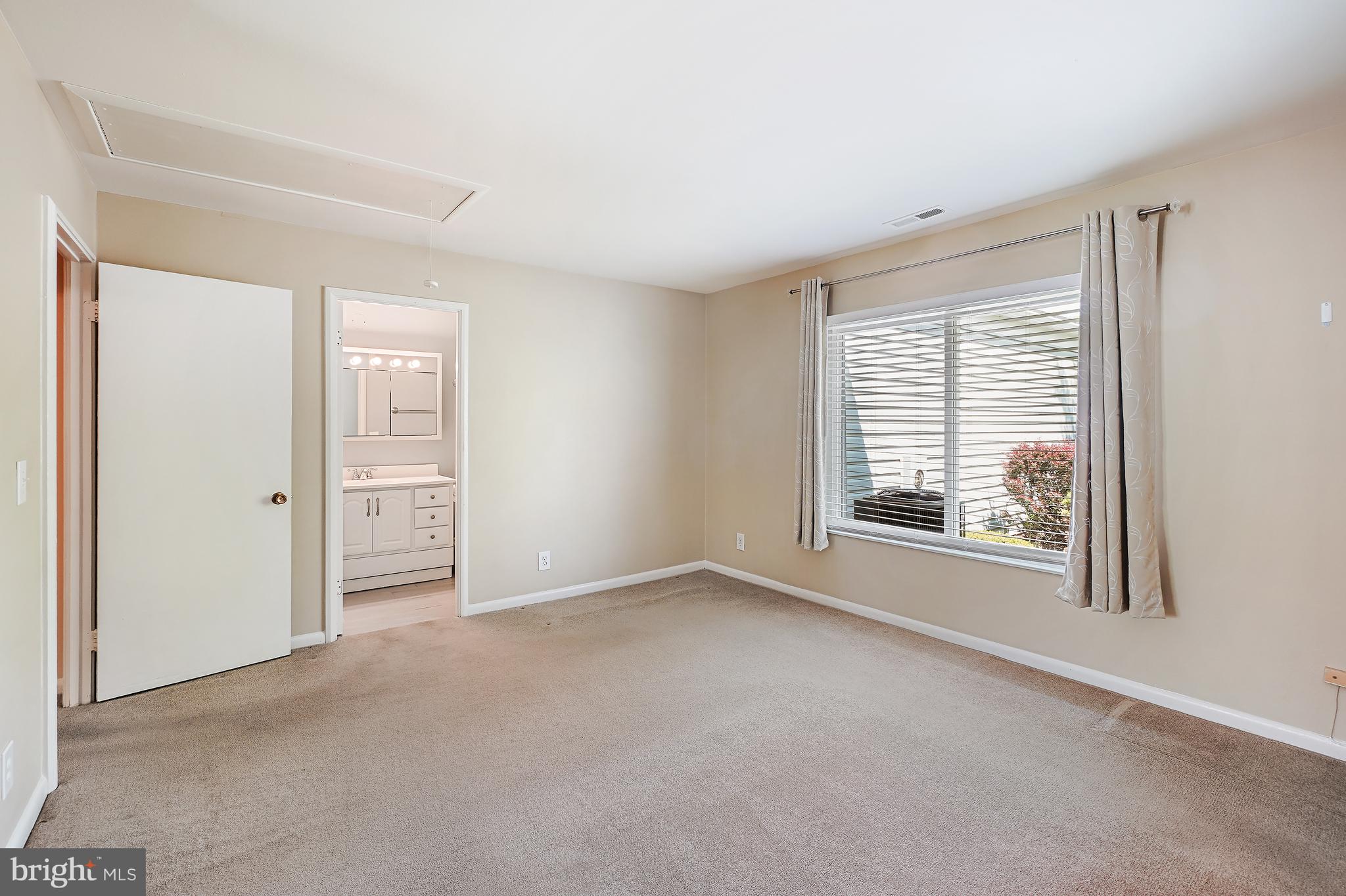 14550 Kelmscot Drive, Unit 186A Silver Spring, MD 20906 - Photo 24 of 29 an empty room with windows