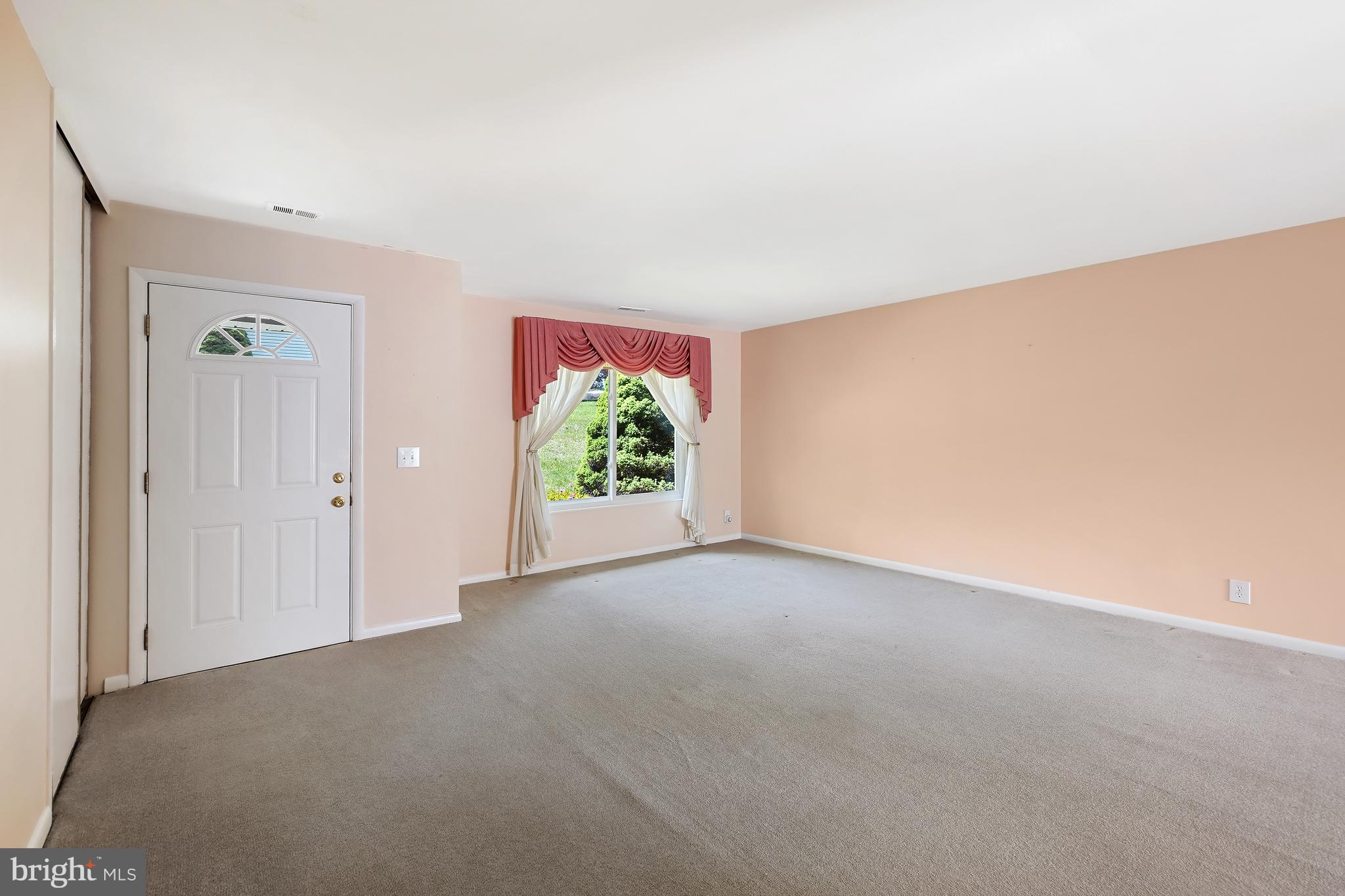 14550 Kelmscot Drive, Unit 186A Silver Spring, MD 20906 - Photo 5 of 29 an empty room with windows and closet