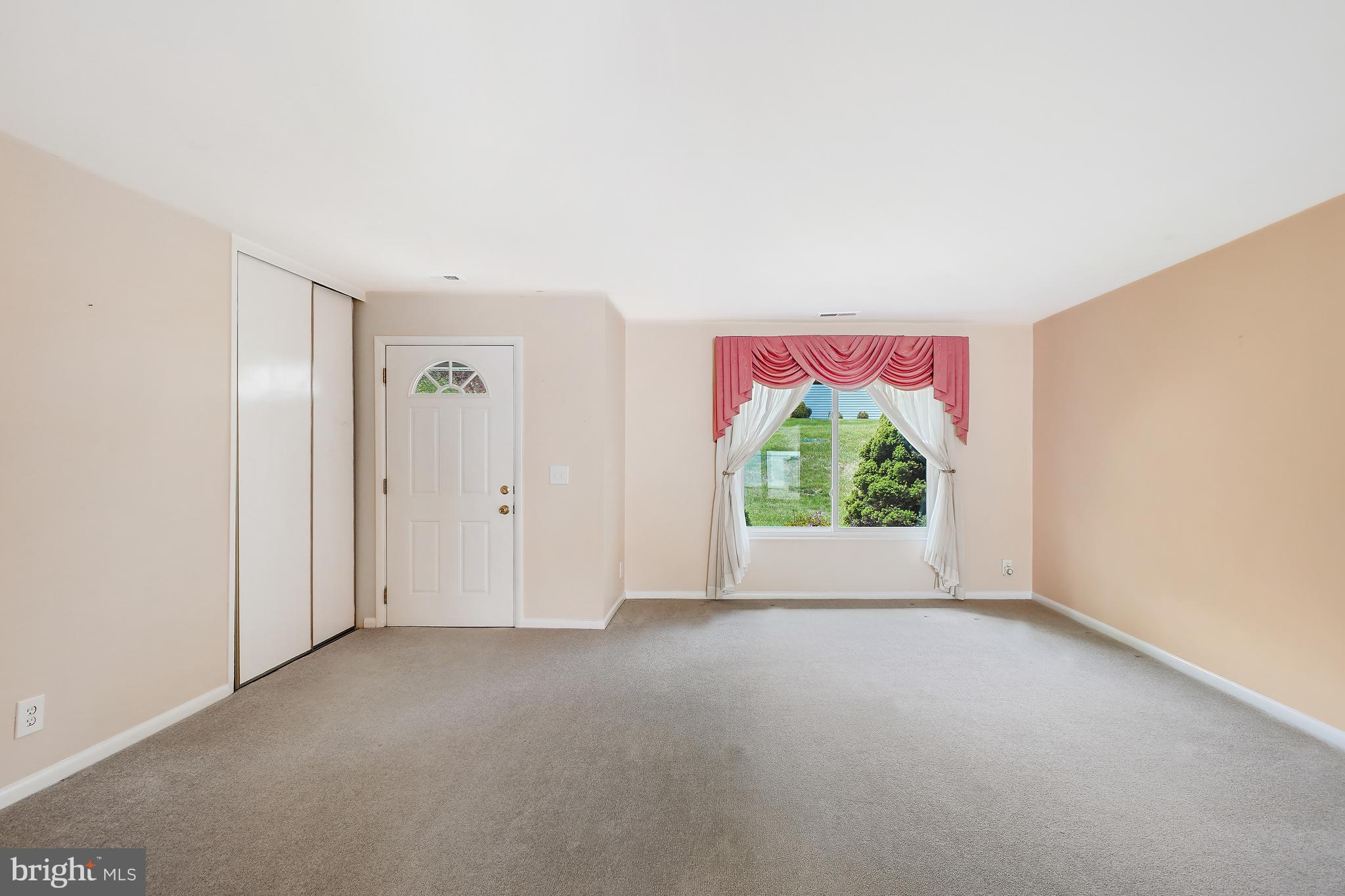 14550 Kelmscot Drive, Unit 186A Silver Spring, MD 20906 - Photo 6 of 29 a view of livingroom with furniture window and front door