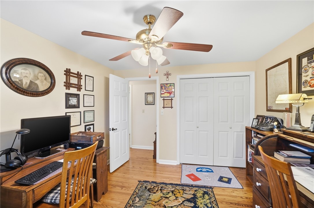 4170 Johnson Road Springfield, OH 45502 - Photo 48 of 54 Hardwood floors and a ceiling fan create a functional, comfortable study area.