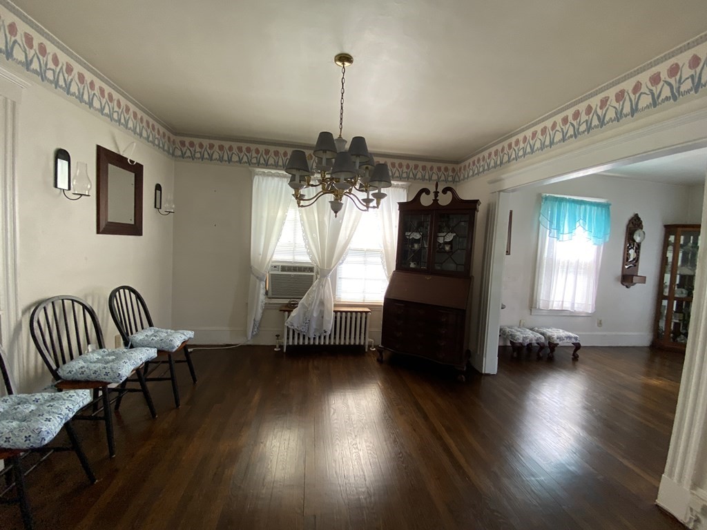 21 Trevalley Road Revere, MA 02151 - Photo 4 of 9 a view of a livingroom with furniture wooden floor and windows