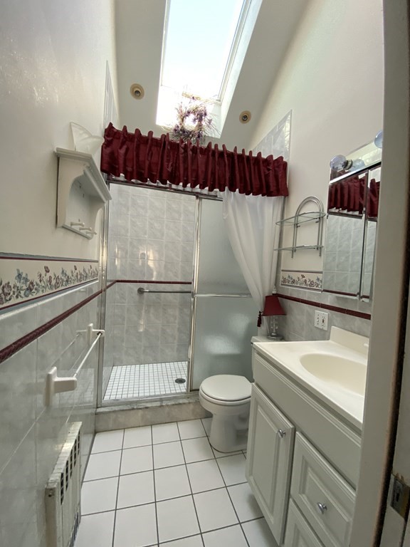 21 Trevalley Road Revere, MA 02151 - Photo 5 of 9 a bathroom with a sink a toilet and shower
