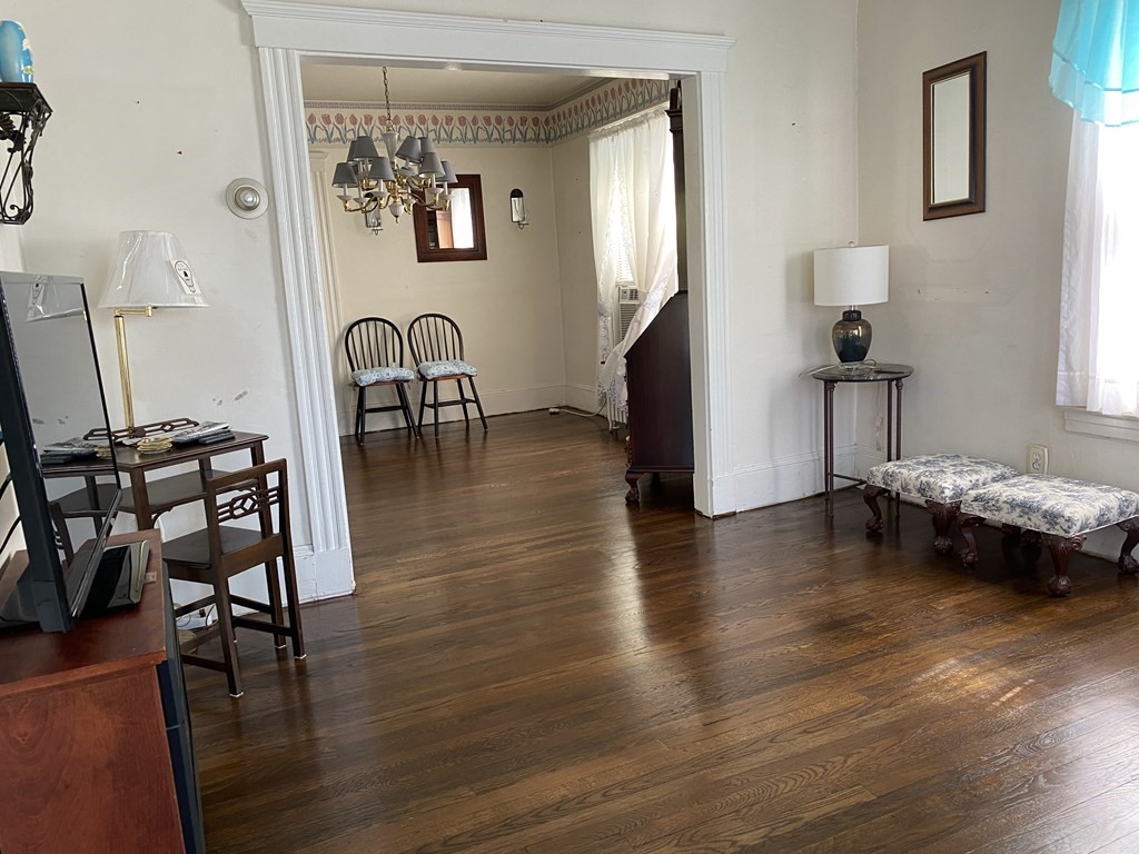 21 Trevalley Road Revere, MA 02151 - Photo 6 of 9 a view of a livingroom with furniture and a flat screen tv