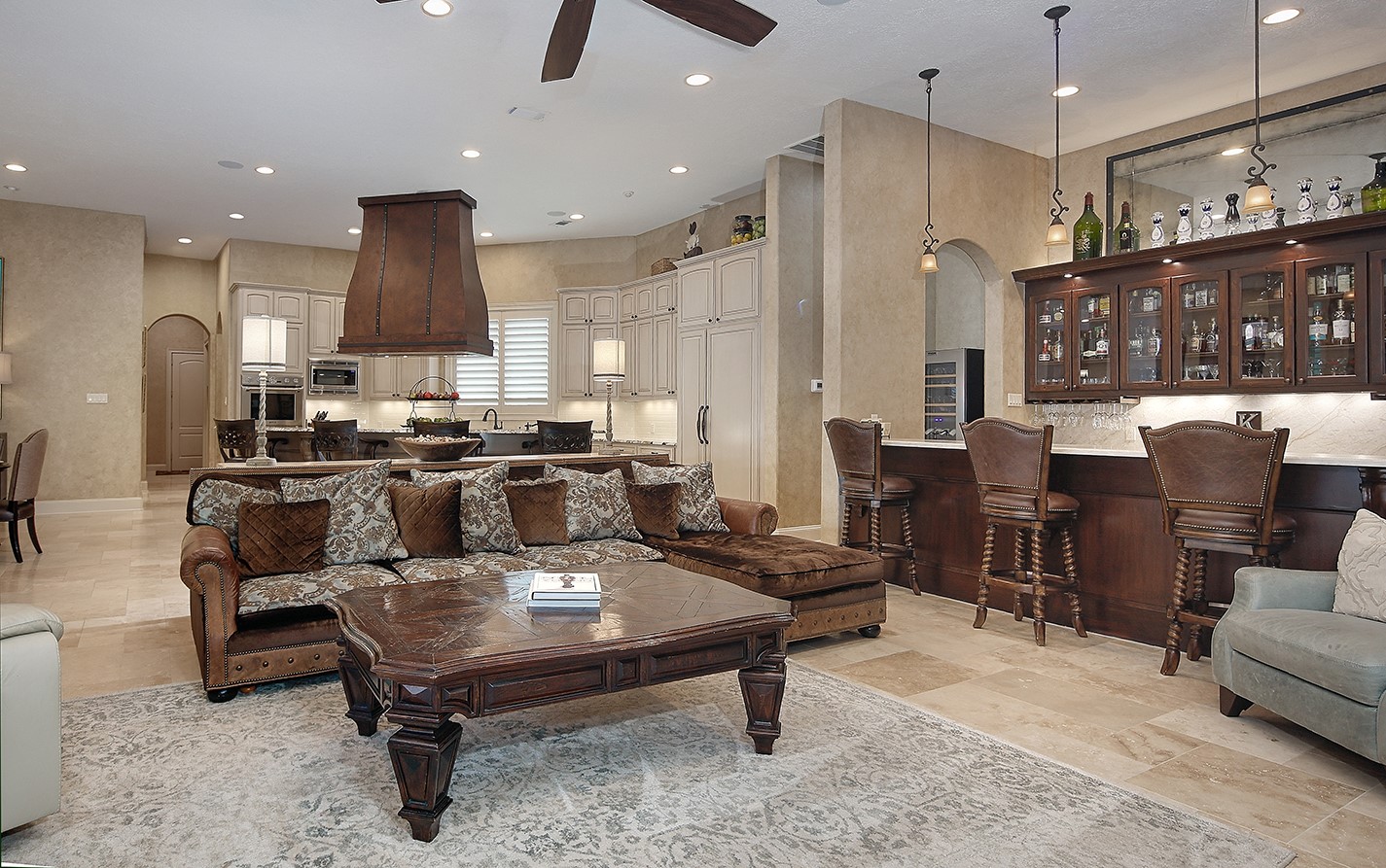 2 Lace Point The Woodlands, TX 77382 - Photo 13 of 48 a living room with furniture a table and kitchen view