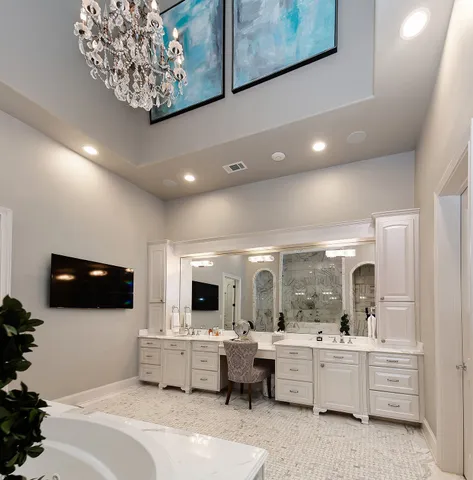 a living room with furniture and flat screen tv