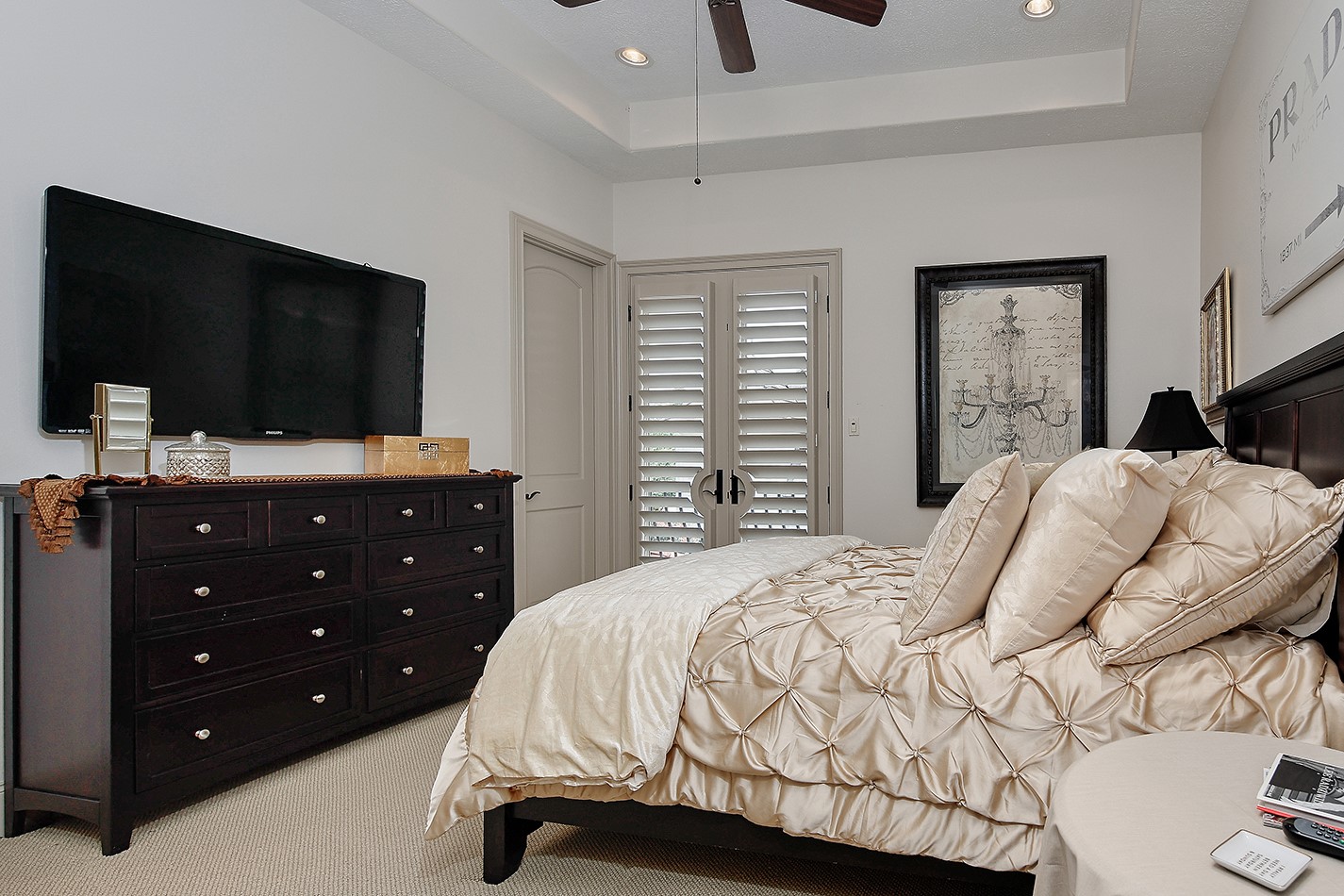 2 Lace Point The Woodlands, TX 77382 - Photo 27 of 48 a bedroom with a bed and a flat screen tv