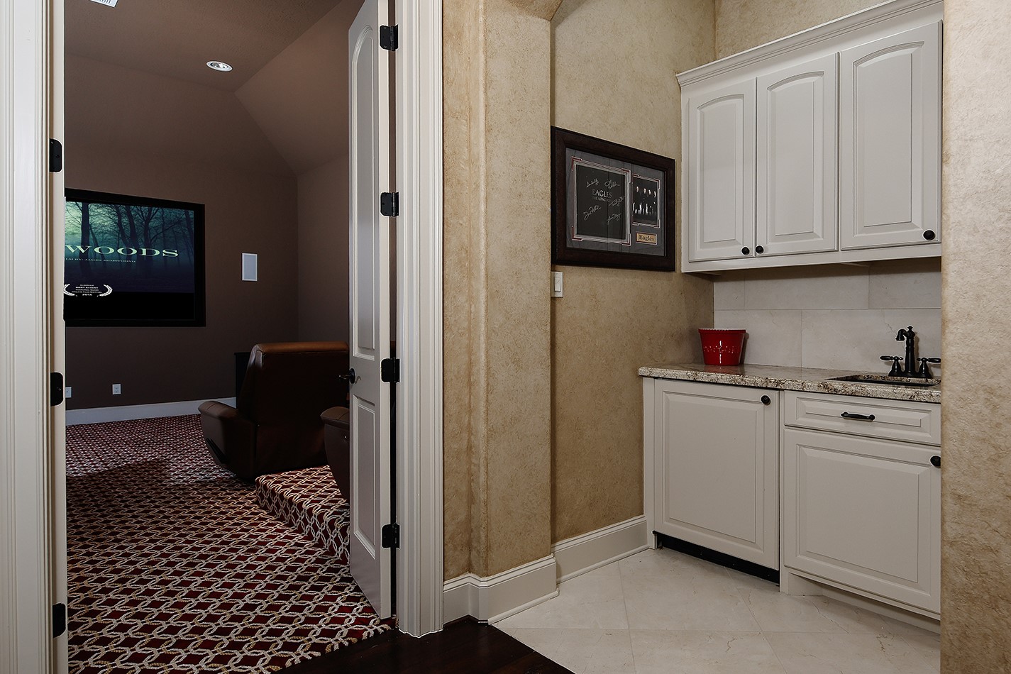 2 Lace Point The Woodlands, TX 77382 - Photo 29 of 48 a kitchen with a refrigerator and cabinets