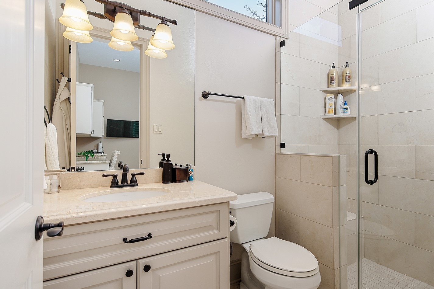 2 Lace Point The Woodlands, TX 77382 - Photo 32 of 48 a bathroom with a sink a toilet and shower