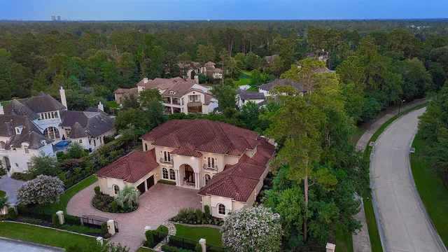 an aerial view of a house with a garden