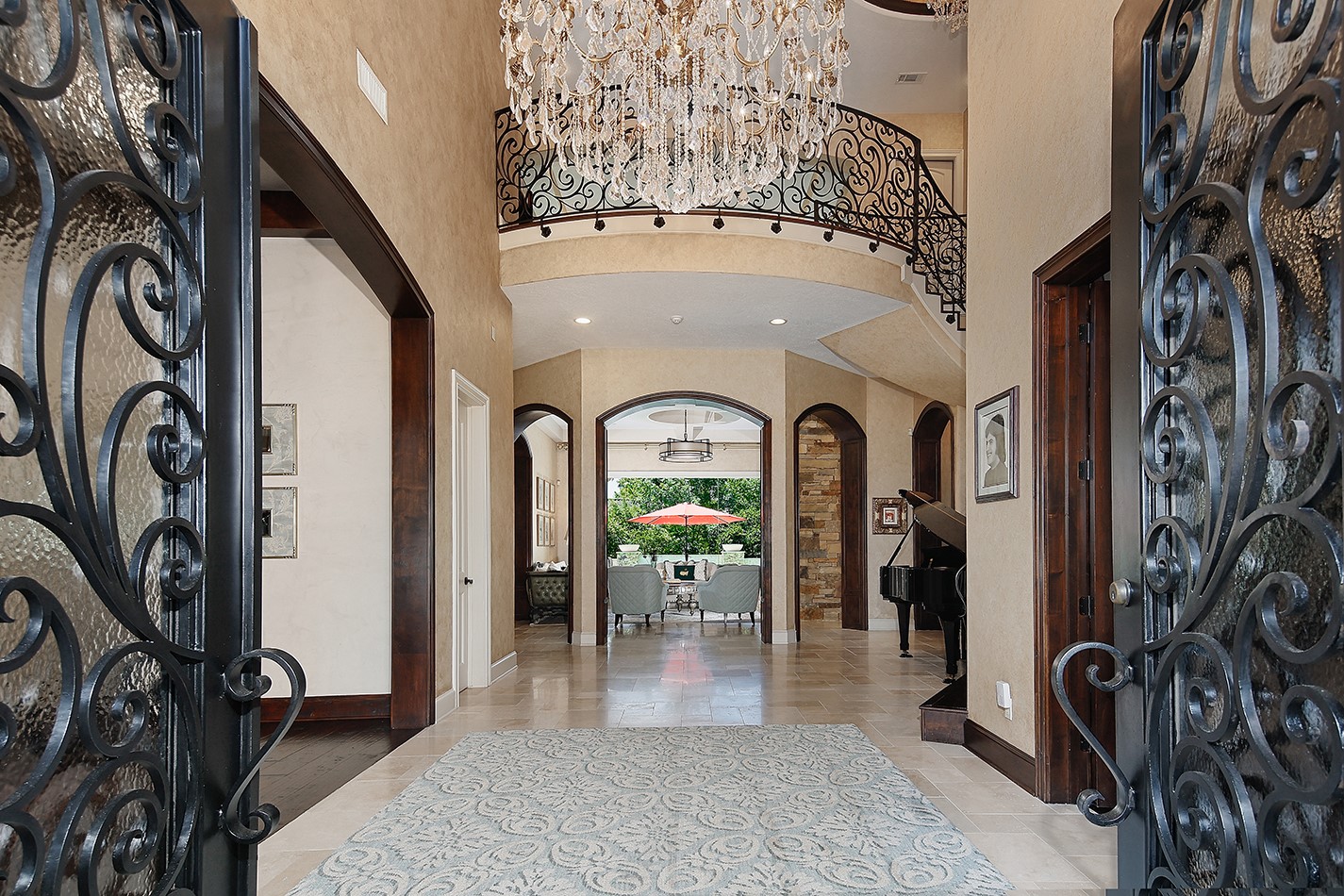 2 Lace Point The Woodlands, TX 77382 - Photo 4 of 48 a view of a hallway with a bike and car parked