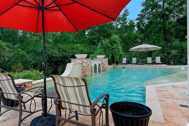 a view of a table and chairs under an umbrella