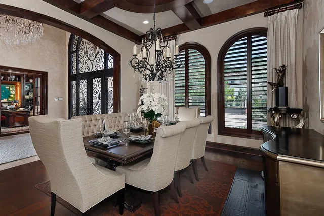a dining room with furniture and window