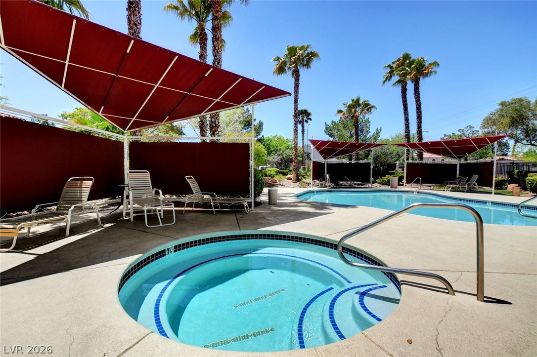 7885 West Flamingo Road, Unit 1050 Las Vegas, NV 89147 - Photo 45 of 62 A refreshing spa and resort-style swimming pool invite relaxation under the desert sun.