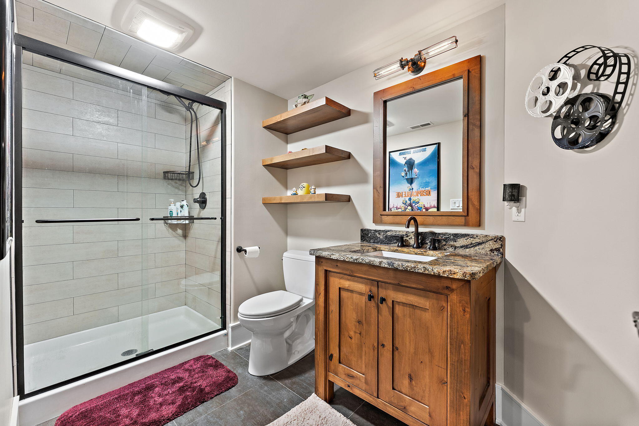 1021 Foy Court Crown Point, IN 46307 - Photo 67 of 88 a bathroom with a granite countertop sink a toilet and shower