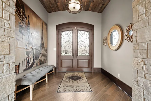 a view of a workspace with furniture and wooden floor