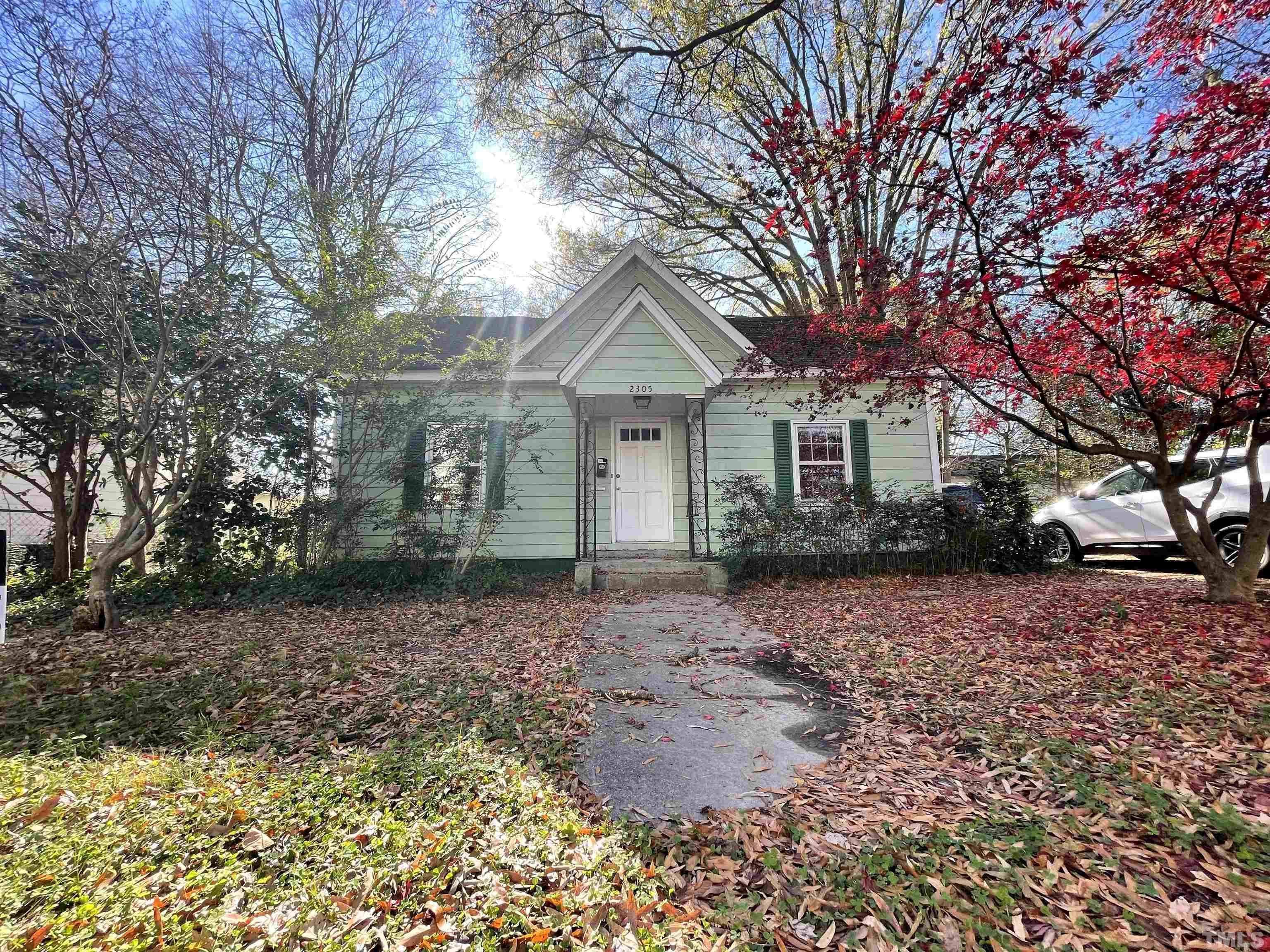 2305 Everett Avenue Raleigh, NC 27607 - Photo 1 of 3 a front view of a house with a garden