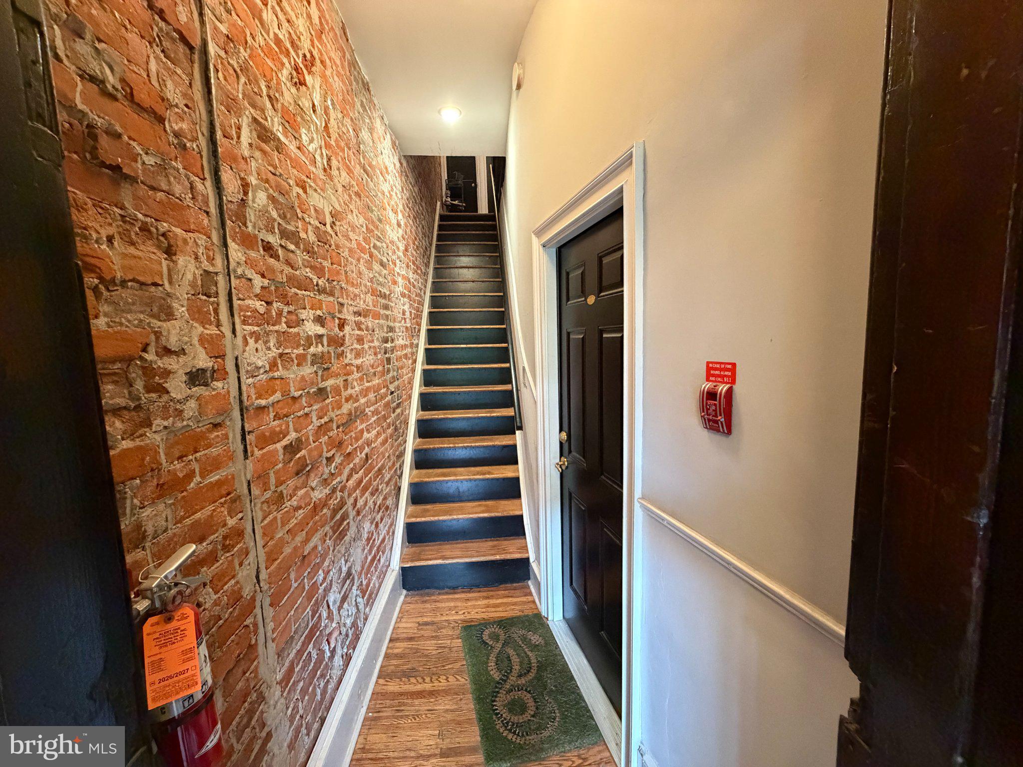 815 South 49th Street Philadelphia, PA 19143 - Photo 66 of 72 a view of a hallway with wooden floor and staircase