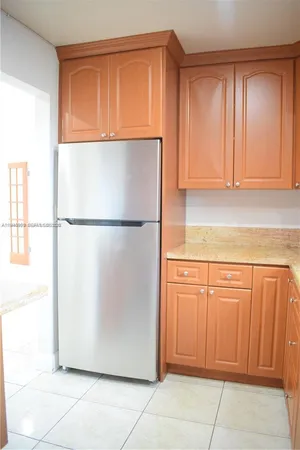 a kitchen with granite countertop cabinets and sink