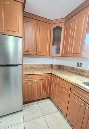 a kitchen with a stove microwave and sink