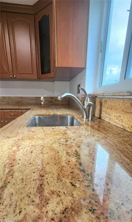 a view of a hallway to rooms and wooden floor