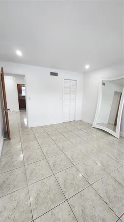 a bathroom with a sink toilet and mirror