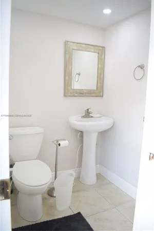a bathroom with a toilet and a bathtub