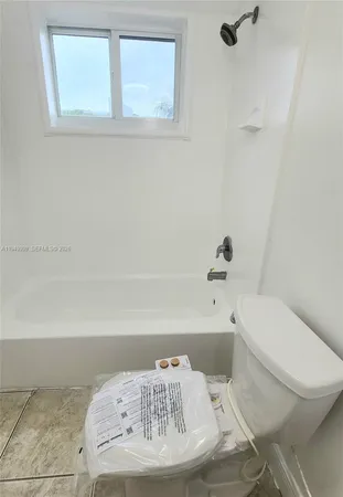 a bathroom with a toilet and a sink