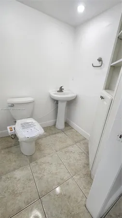 a bathroom with a toilet and a bathtub
