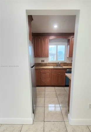 a kitchen with a sink a refrigerator and a sink