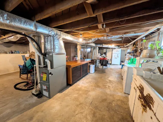 a dining room with furniture and a window