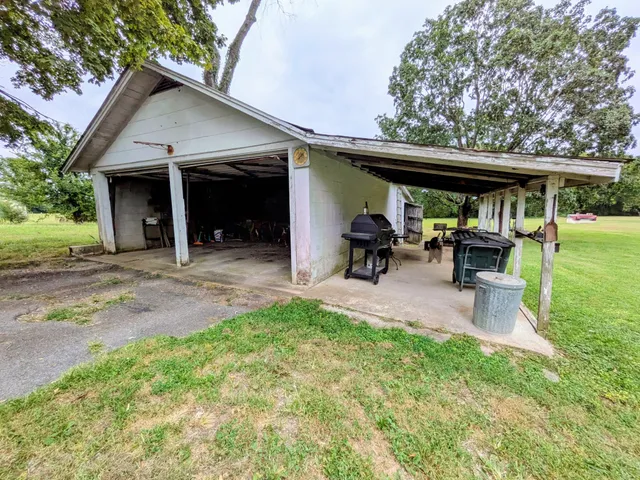 a view of an house with swimming pool garden and seating area