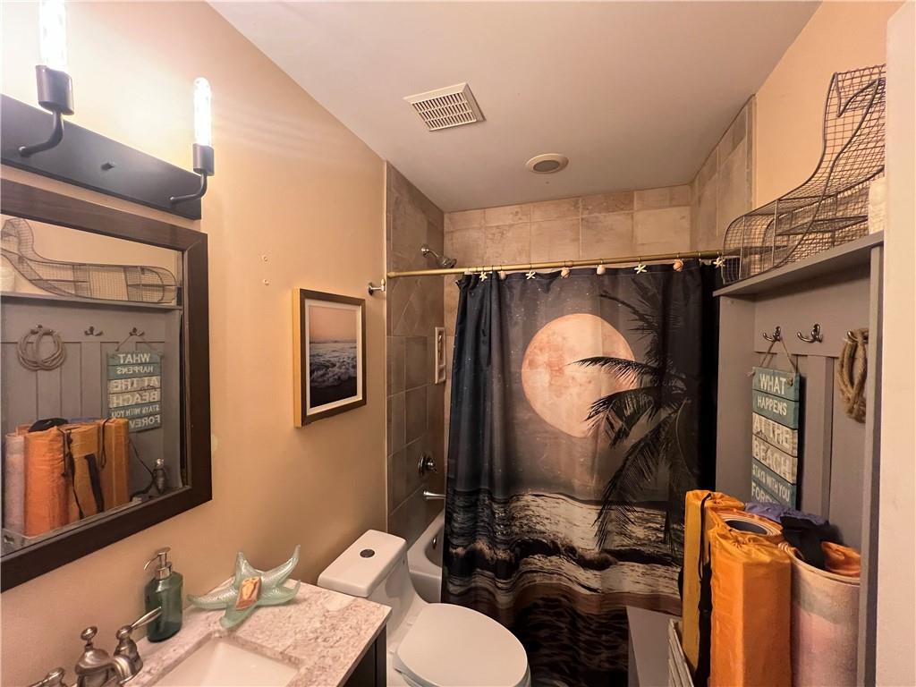 1045 Fincher Road Canton, GA 30114 - Photo 43 of 49 a bathroom with a sink mirror vanity and toilet