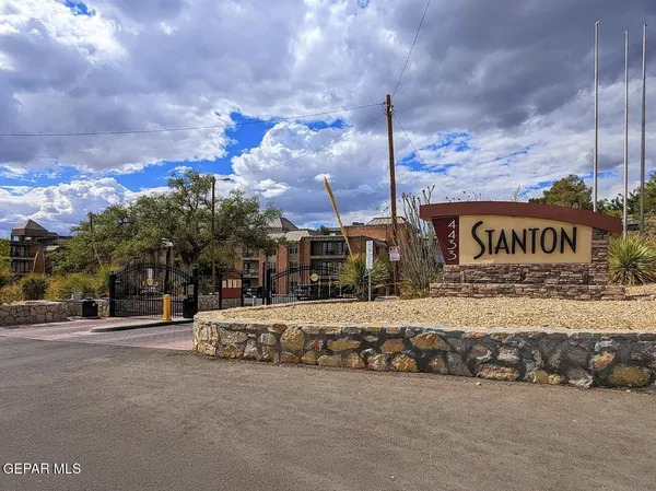 a sign board on the side of a street