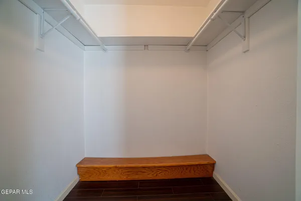 a view of room with racks on the wall