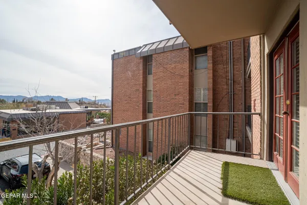 a view of a balcony with wooden floor and outdoor space