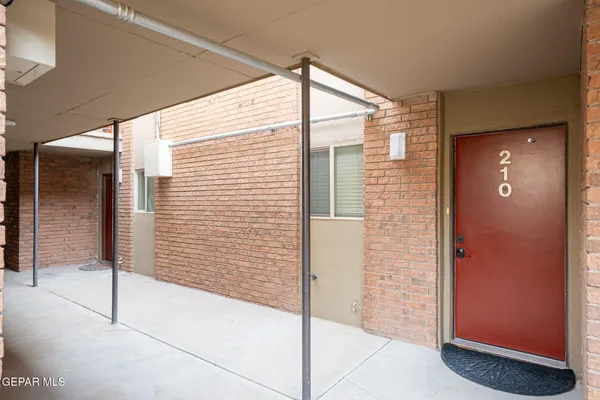 a bathroom with a shower and a glass door
