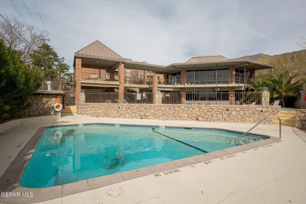 a view of a house with swimming pool