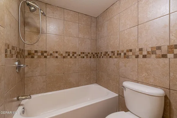 a bathroom with a toilet and shower