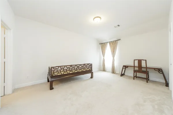 a view of workspace with furniture and window