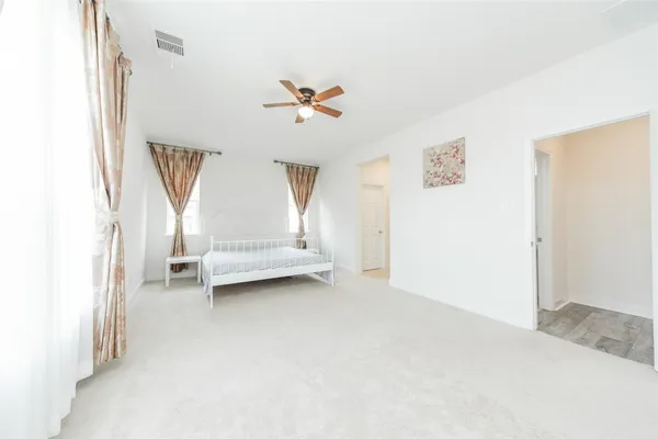a view of room with stairs and a chandelier