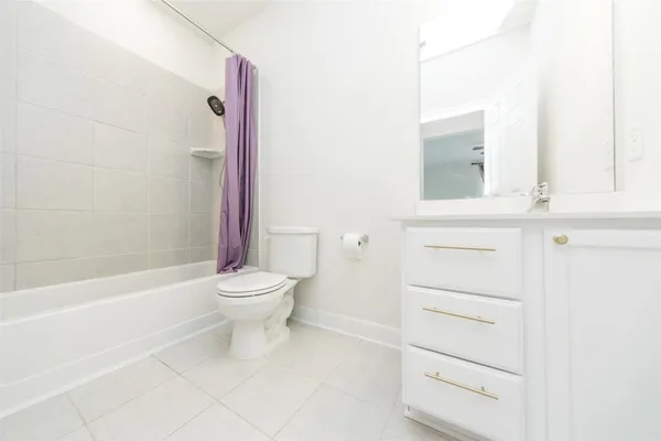 a bathroom with a toilet a sink and a bathtub