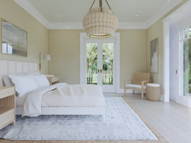 a spacious bedroom with a bed and a window