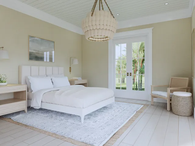a spacious bedroom with a bed and a chandelier
